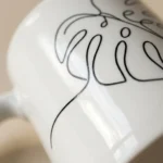Monstera Mug, close-up of the line drawing