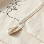 Two Faces Tea Towel, close-up of the line drawing