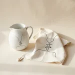 Two Faces Tea Towel, styled with other pieces