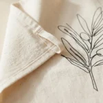 Olive Branch Tea Towel, close-up of the line drawing